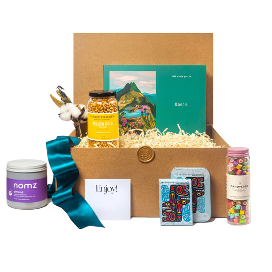 Epic games night gift basket with puzzle, popcorn, Candylabs candy, Nomz and Native Design playing cards