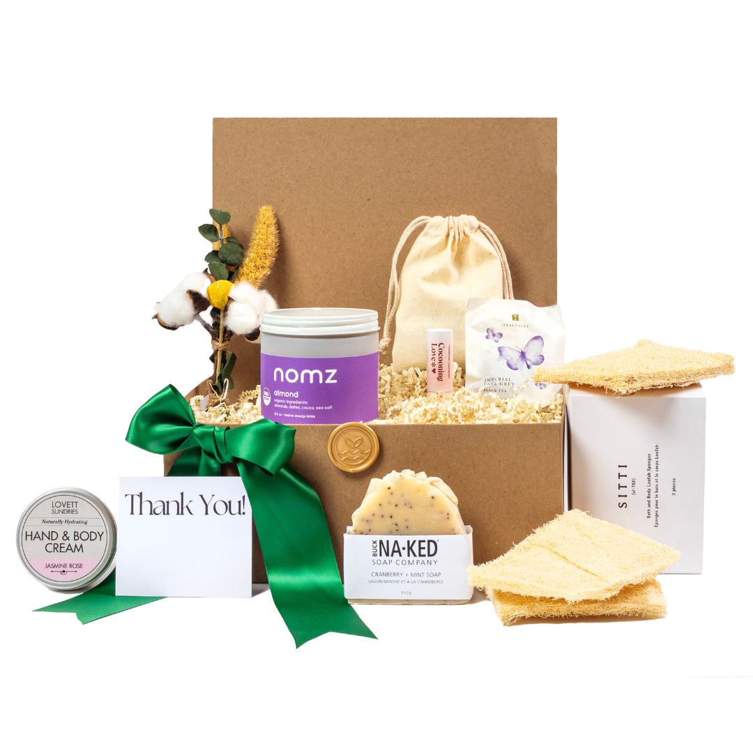 Relaxation gift basket with luxury teas, jasmine rose hand and body cream, Nomz, buck naked aritisinal soap and cocooning love lip balm.