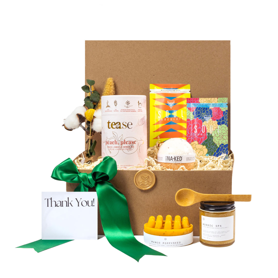 Premium eco-friendly detox gift basket with organic, locally-sourced products including herbal teas, bath bomb, artisan chocolates, spa scrub, bamboo spoon, and massage soap bar. Perfect sustainable gift for clients, employees, or eco-conscious individuals. Packaged with green ribbon and 'Thank You' card for a thoughtful presentation