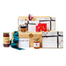 Elegant wooden gift basket featuring an assortment of gourmet, locally-sourced Canadian treats including artisanal jams, honey with a honey dipper, premium chocolates, and specialty cookies. Perfect for corporate gifting, this sustainable, plastic-free basket includes a thoughtful 'Thank You' card, ribbon, and eco-friendly packaging. Ideal for client appreciation, employee recognition, and holiday gifts.