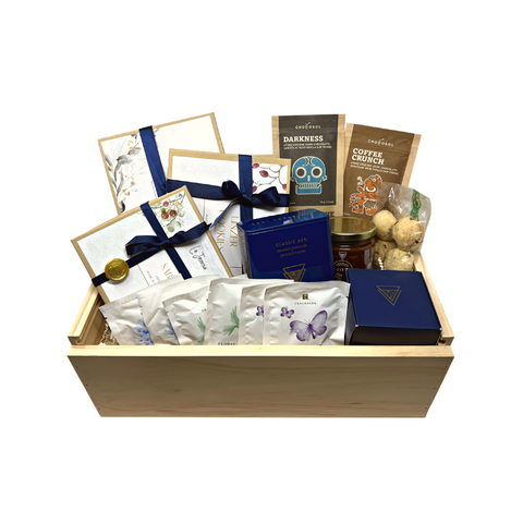 Executive office sharing gift basket filled with gourmet local Canadian produxts in sustainable packaging