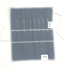 Portable utensil pouch alone open